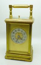 A brass and four glass sided carriage clock with repeater, movement a/f