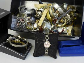 A collection of wristwatches and a lady's Rolex gold plated buckle