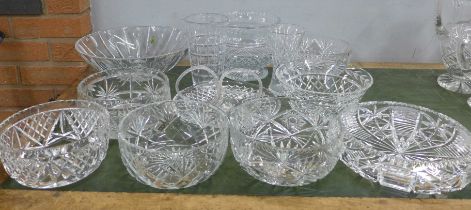 A large collection of crystal and glass bowls, vases and a pair of baskets, fourteen in total **