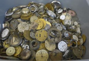 A large collection of pocket watch and wristwatch movement parts for spares/repair