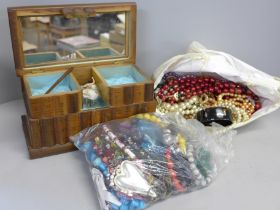A tub of costume jewellery and a Burmese jewellery box