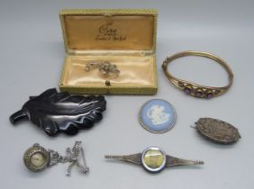 Two silver brooches, a white metal framed Wedgwood plaque, a jet brooch (a/f), a gold plated