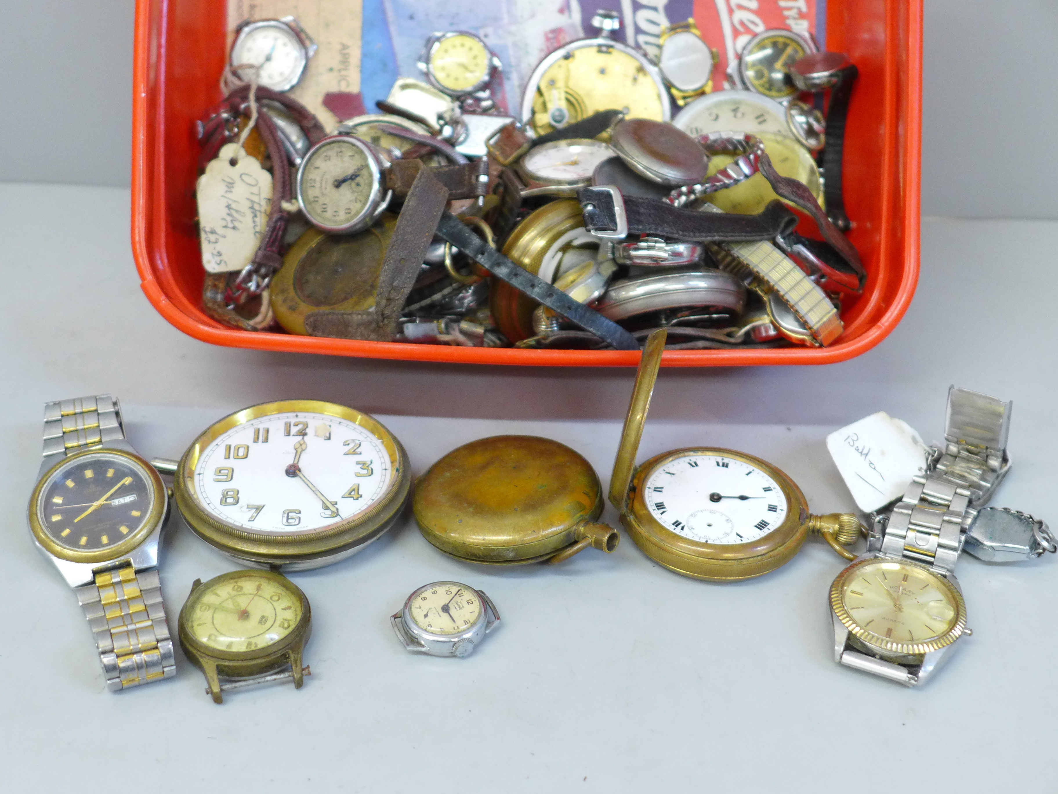 A collection of pocket watch and wristwatch movements and cases, for spares/repair
