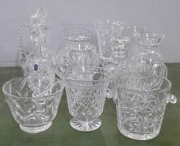 A large collection of crystal and glass decanters, jugs, ice bucket, vases, fourteen in total **