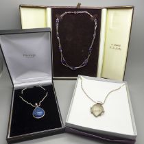 A silver and amethyst necklace and two silver and gemstone pendants and chains