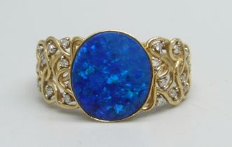 A 9ct gold ring set with a boulder opal and diamonds, 3.6g, V/W