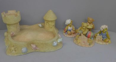 A Cherished Teddies beach sandcastle display stand and four bears
