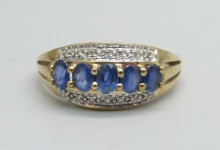 A 9ct gold ring set with five sapphires and 14 small diamonds, 2.6g, T