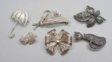 Six white metal and silver brooches - marcasite set brooches both marked as silver, one filigree