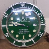 A Rolex style dealers circular wall clock