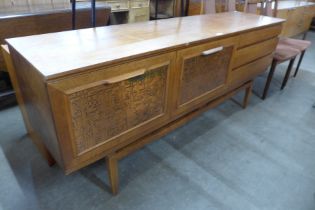 A Beautility teak and copper sideboard