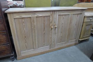 A Victorian pitch pine two door pantry cupboard