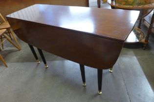 A G-Plan Librenza tola wood and black drop-leaf table