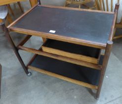 A Danish C.F.C. rosewood and black lacquered cocktail trolley, designed by Johannes Anderson,