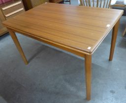 A Danish teak extending dining table