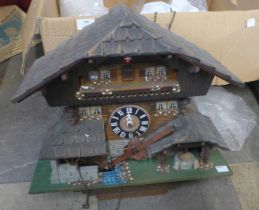 A Swiss painted wooden cuckoo clock