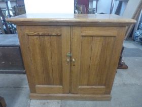 A Victorian pitch pine fitted two door pantry cupboard