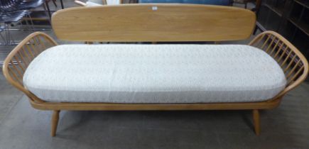 An Ercol Blonde ash and beech 355 model studio couch