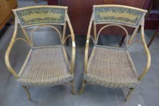 A pair of Italian bamboo and rattan elbow chairs