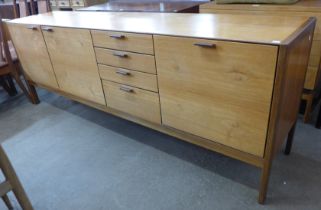 A Meredew teak sideboard with stitched leather handles