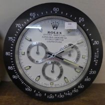 A Rolex style dealers circular wall clock