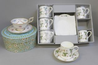 A Wedgwood Wild Strawberry six setting coffee set, boxed, and a Wedgwood Harlequin Collection cup