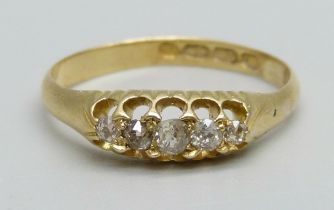 An 18ct gold ring set with five diamonds, 2.1g, M