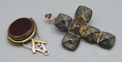A Masonic swivel pendant and a Masonic ball pendant, a/f