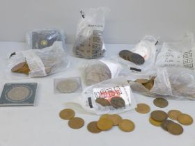 A collection of coins including commemorative crowns