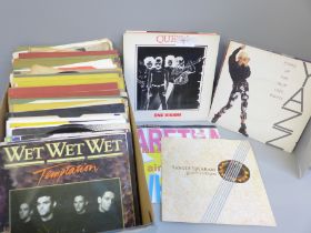 A collection of 45rpm records (65) including Queen
