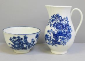 An 18th Century Worcester blue and white tea bowl and sparrow beak jug, both with crescent mark,