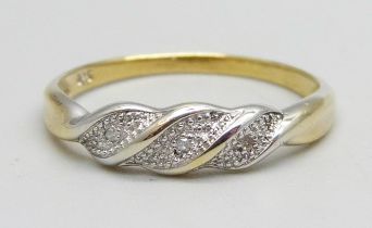 A silver gilt, three stone diamond twist ring, Q