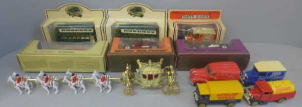 A box of die-cast model vehicles including Days Gone, Thunderbird 2, etc.