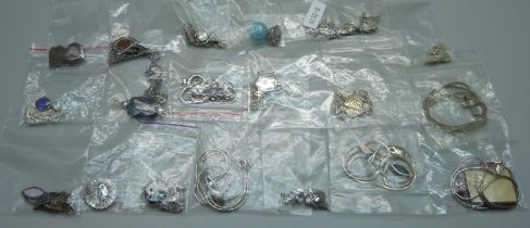 Eighteen silver pendants and chains, and two silver plated pendants on silver chains