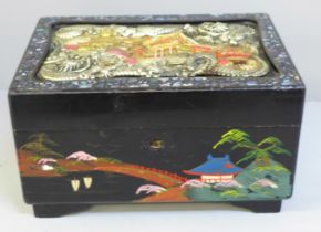 A Japanese lacquered musical jewellery box