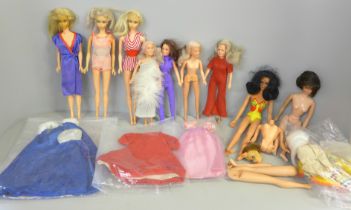 Three 1960s Barbie dolls with 1959 original designer gowns, one undressed Charlies Angels doll and