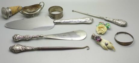 A collection of silver and silver mounted items including silver handled implements, silver