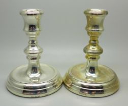 A pair of small silver candlesticks, 11cm