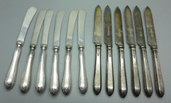 Two sets of six silver handled knives