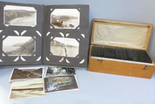 An album of Edwardian and later postcards and a box of Edwardian glass negatives, mainly family