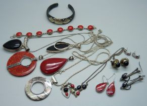 A collection of silver jewellery, many pieces set with coral including pendants, a bracelet,