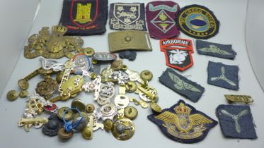 Military badges, cloth badges and a US Marine Corps belt buckle