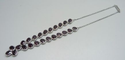 A silver and garnet set neck chain, 26g, approximately 42cm