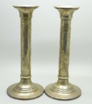 A pair of silver candlesticks, marked Barton Silver, weighted, 18cm