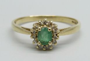 A 9ct gold, emerald and diamond cluster ring, 2.2g, U