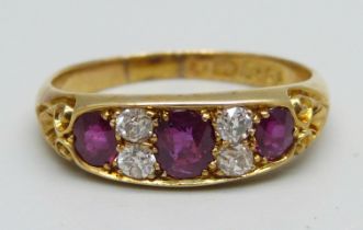 A Victorian 18ct gold ring set with three rubies and four diamonds, 4.3g, S