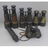 Four pairs of binoculars, including The Gamage, and a telescope