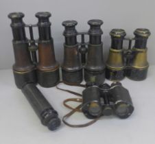Four pairs of binoculars, including The Gamage, and a telescope