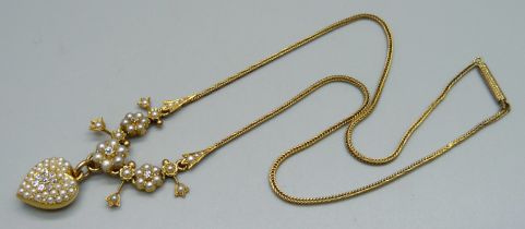 A yellow metal necklet set with a diamond cluster and seed pearls on a foxtail link chain, chain