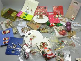 A collection of Christmas themed jewellery including earrings and brooches